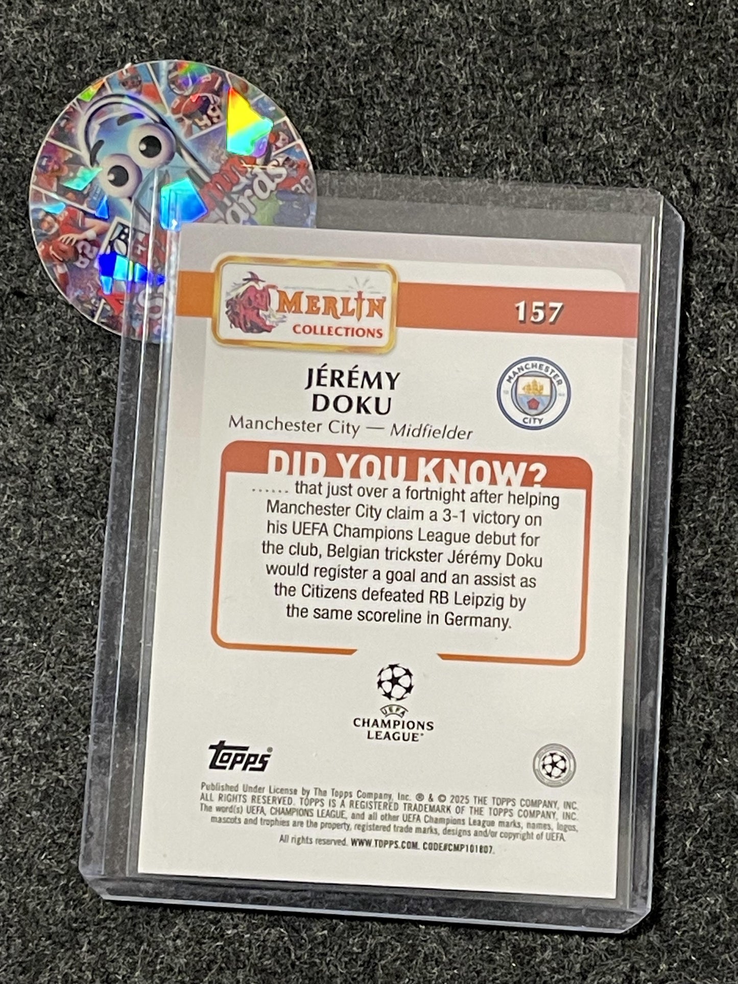 2024-25 Topps Merlin UCC #157 Jeremy Doku Rose Gold Speckle Refractor /250 Manchester City SN