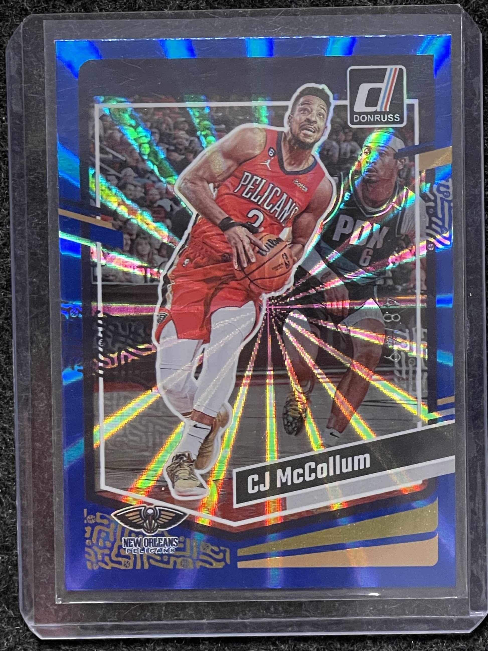 2023-24 Donruss #95 CJ McCollum Blue Laser Holo #/49 New Orleans Pelicans SN