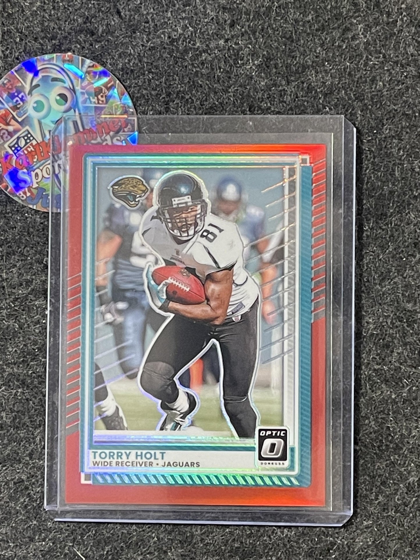 2025 Donruss Optic #91 Torry Holt Red #/149 Jacksonville Jaguars SN