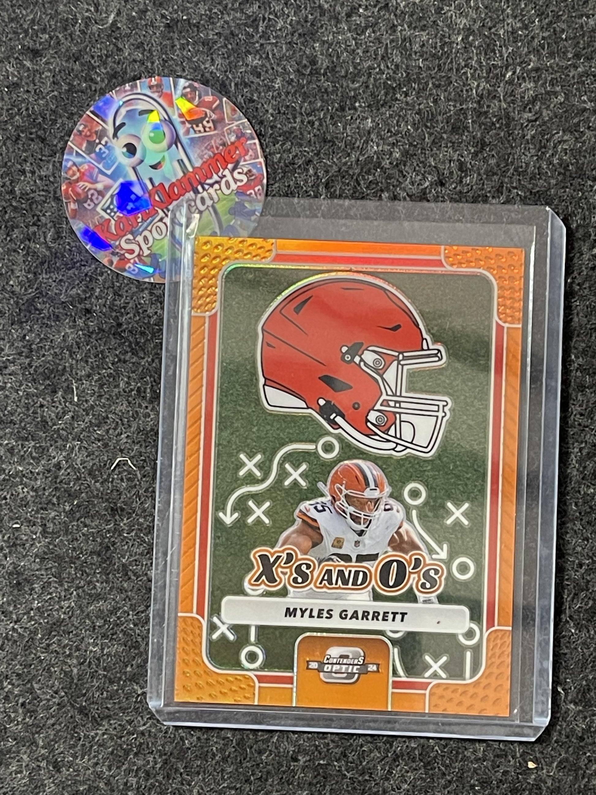 2024 Panini Contenders Optic #XO-MGT Myles Garrett Xs and Os Orange #/50 Cleveland Browns SN