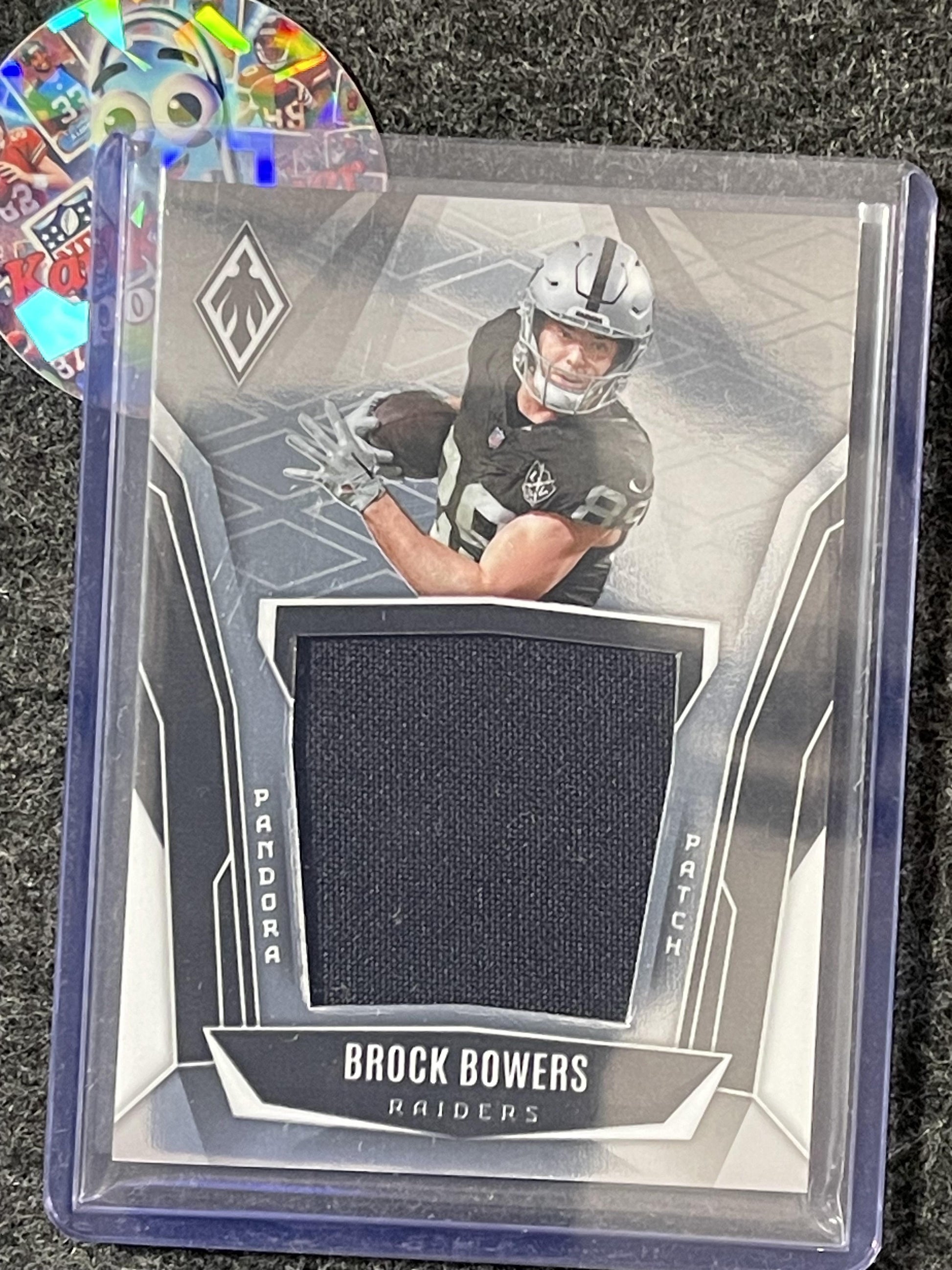 2025 Panini Phoenix #PAP-BBS Brock Bowers Pandora Patch #/299 Las Vegas Raiders SN,MEM