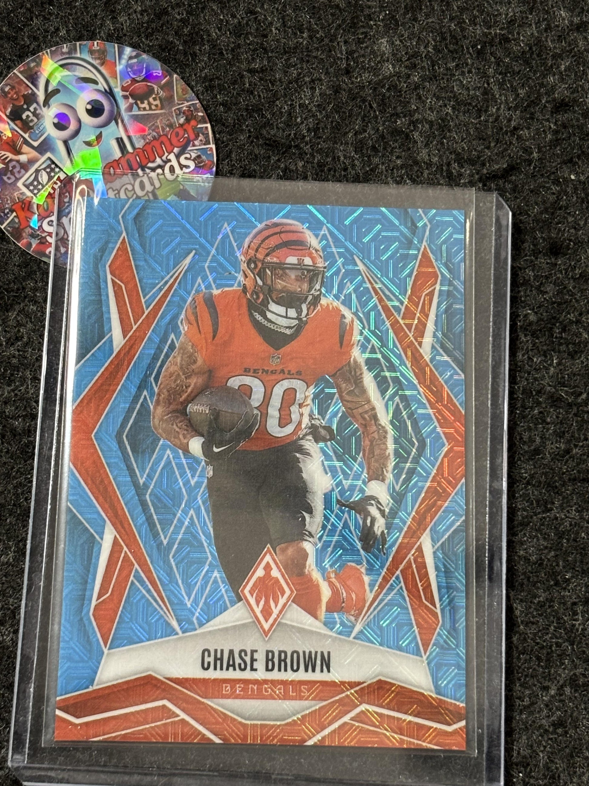 2025 Panini Phoenix #92 Chase Brown Light Blue Mojo Prizm #/85 Cincinnati Bengals SN
