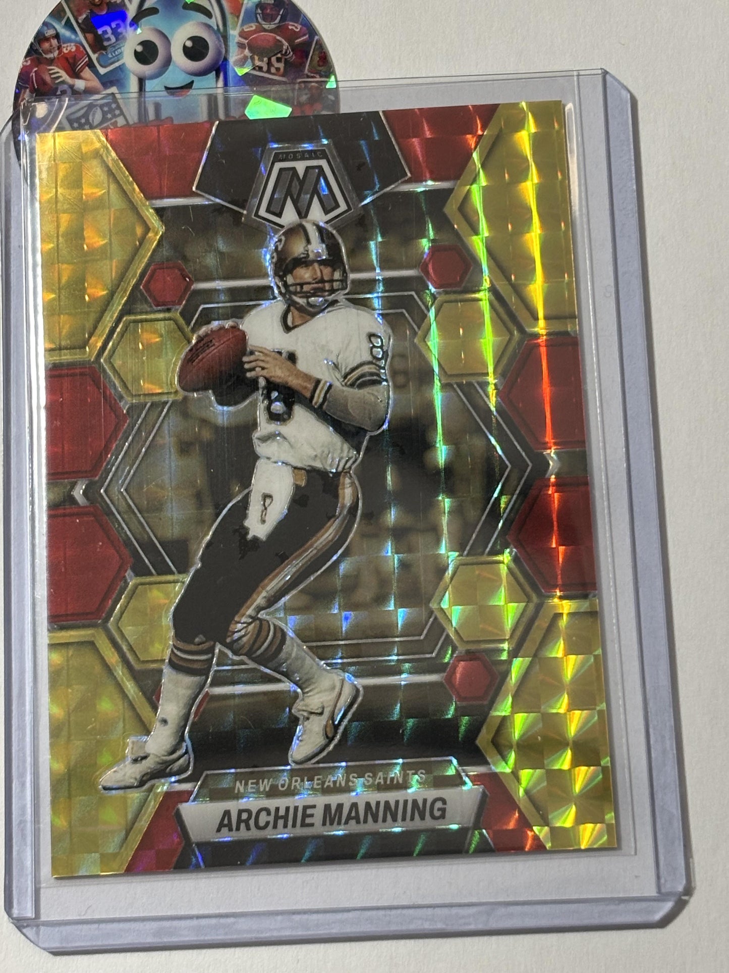 2023 Panini Mosaic #173 Archie Manning Red and Yellow Fusion Mosaic #/80 New Orleans Saints SN