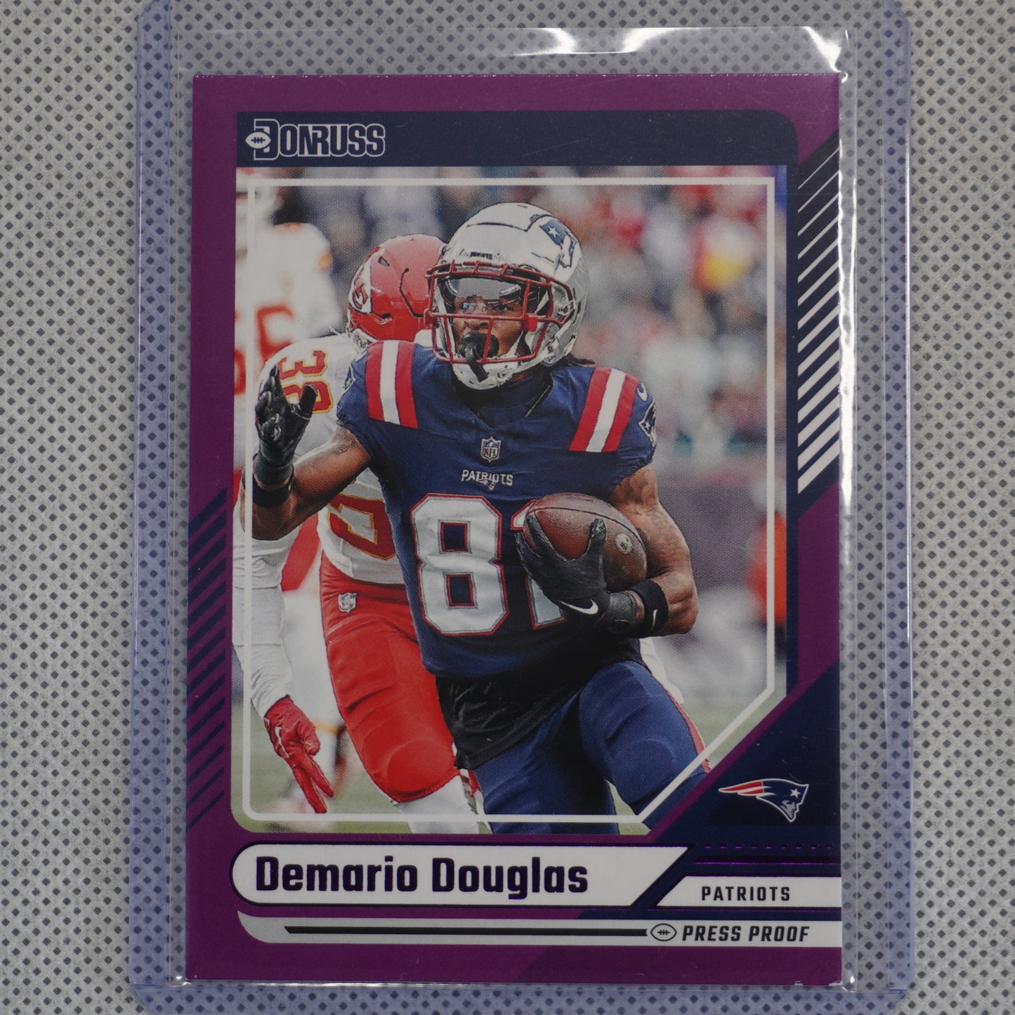 2024 Donruss #91 Demario Douglas Press Proof Purple New England Patriots