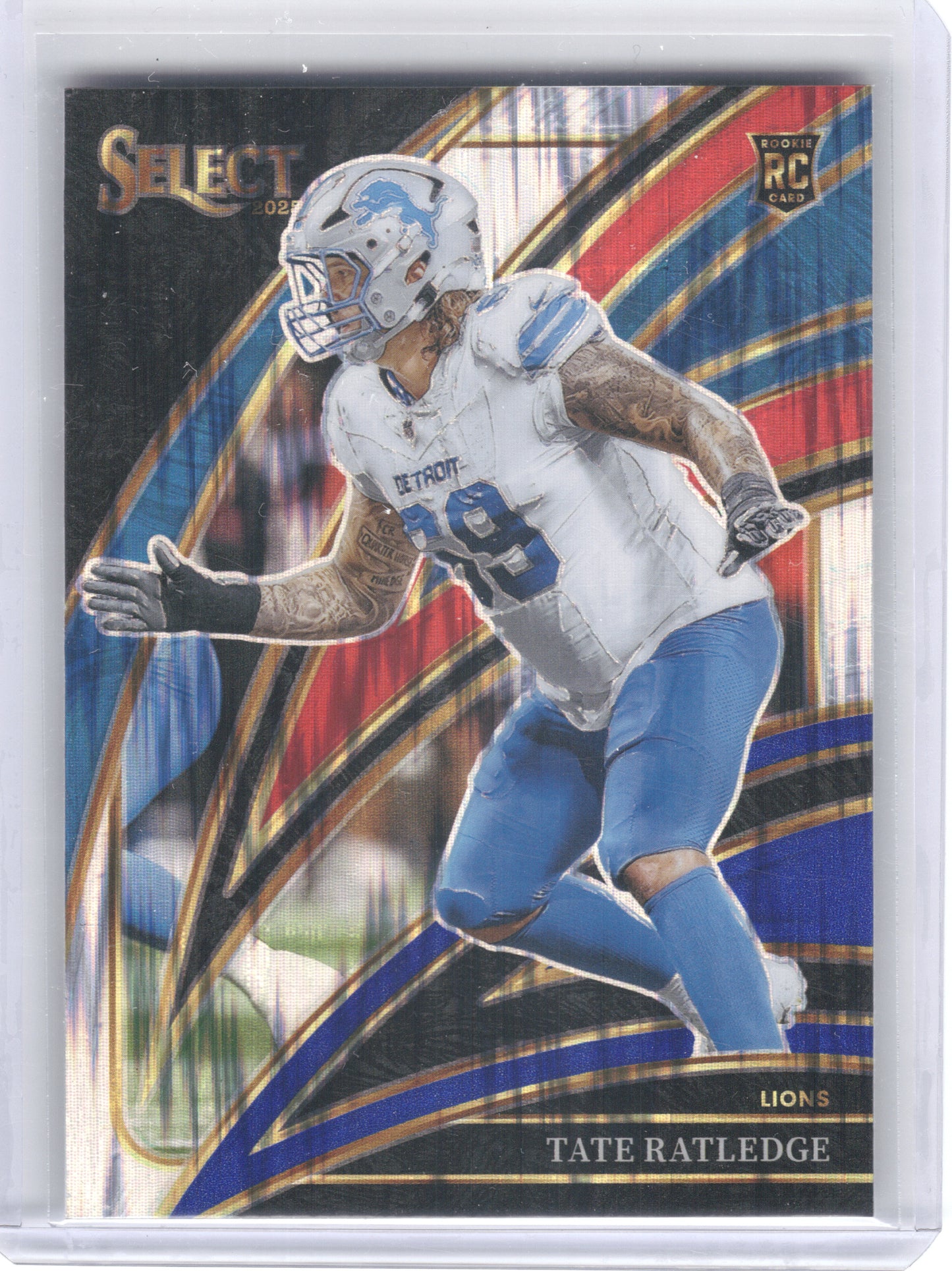 2025 Panini Select #270 Tate Ratledge Red and Blue Prizm Shock Detroit Lions