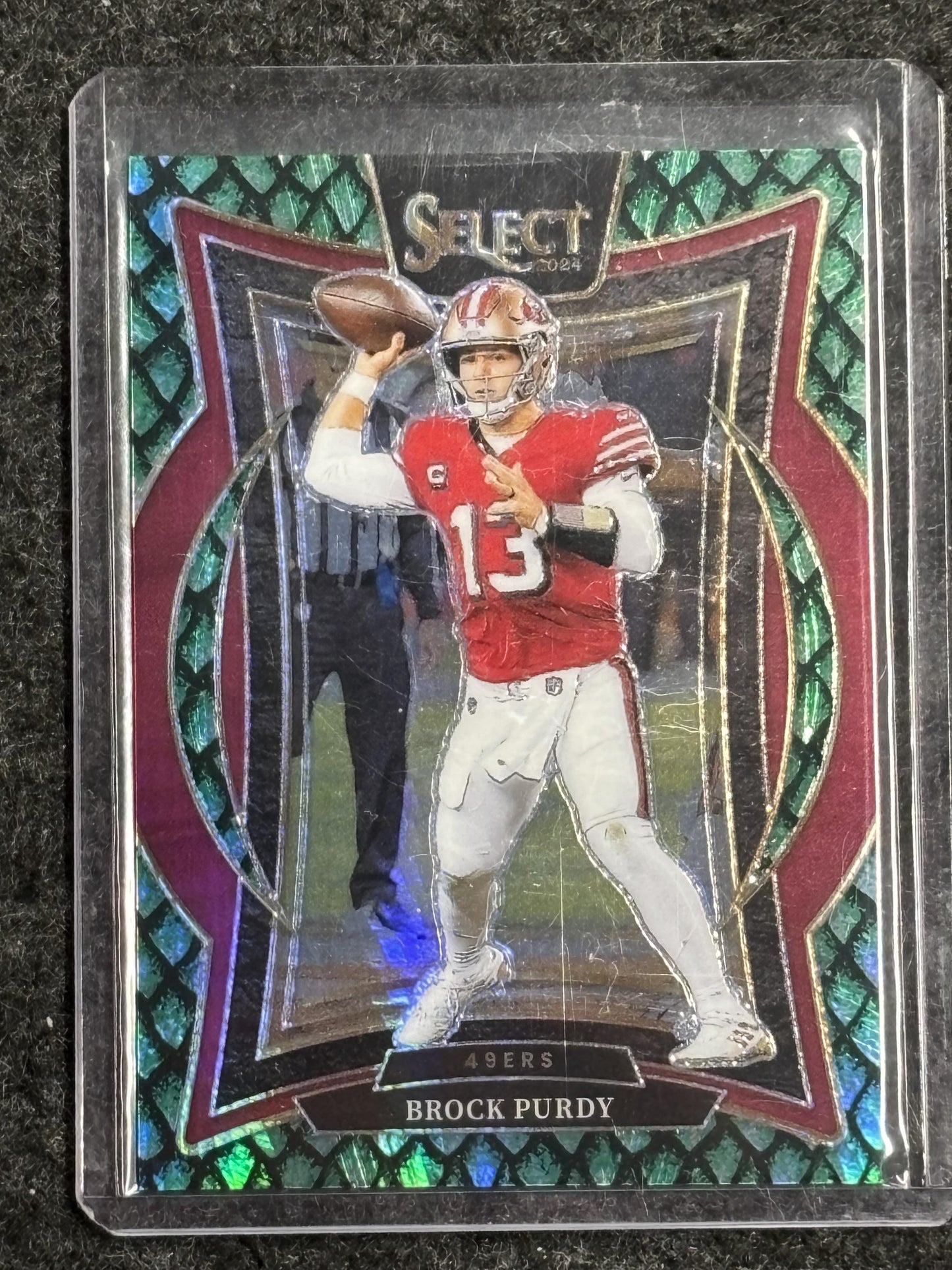 2024 Panini Select #37 Brock Purdy Dragon Scale Prizm #/81 San Francisco 49ers SN