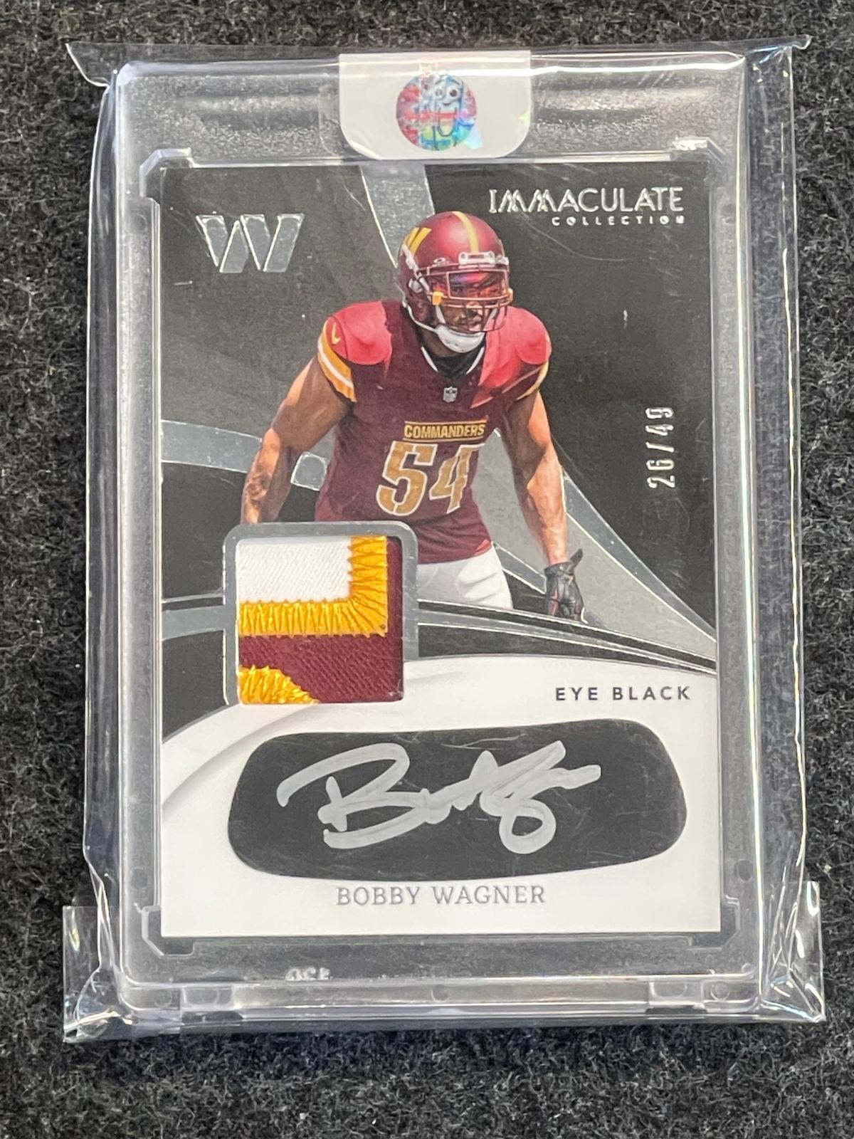 2024 Panini Immaculate Collection #IEBJ-BWR Bobby Wagner Immaculate Eye Black Jersey #/49 Washington Commanders SN, MEM, AU